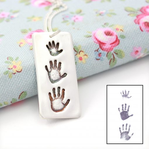 Silver hand print jewellery for 3 children