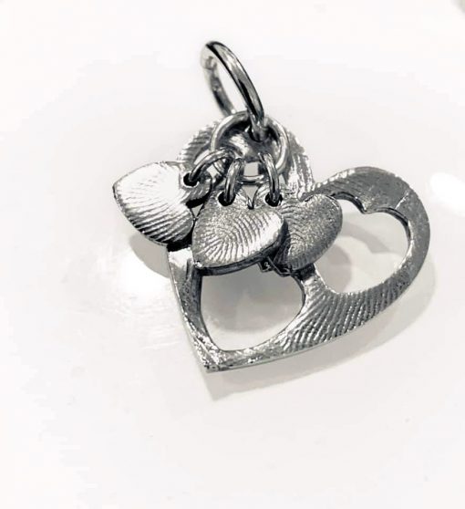Silver fingerprint cut out heart pendant